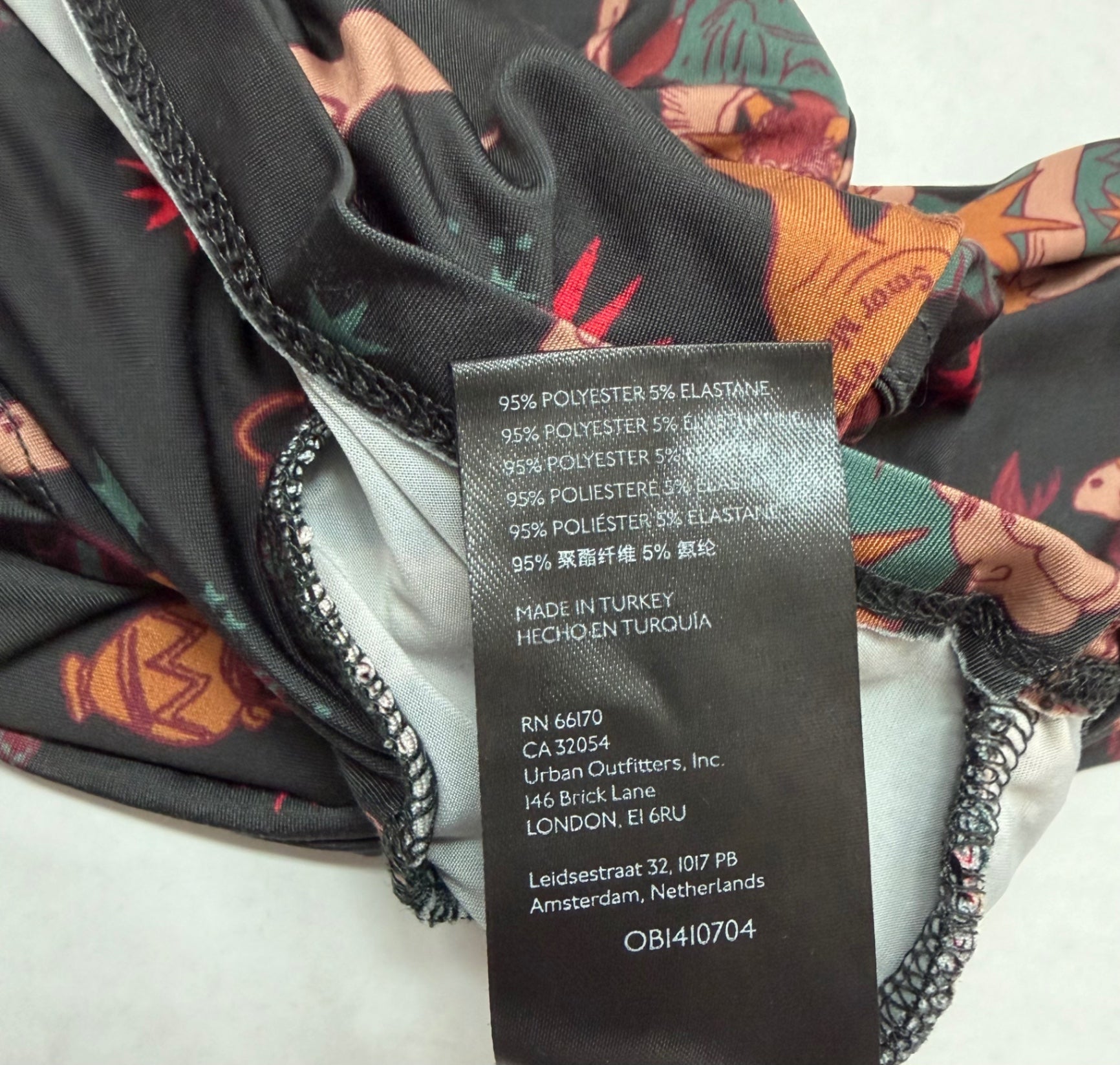 Urban Outfitters Tops Small Multicolor (Black, Red, Orange, and other shades)Polyester, Elastane, and possibly some printed fabric