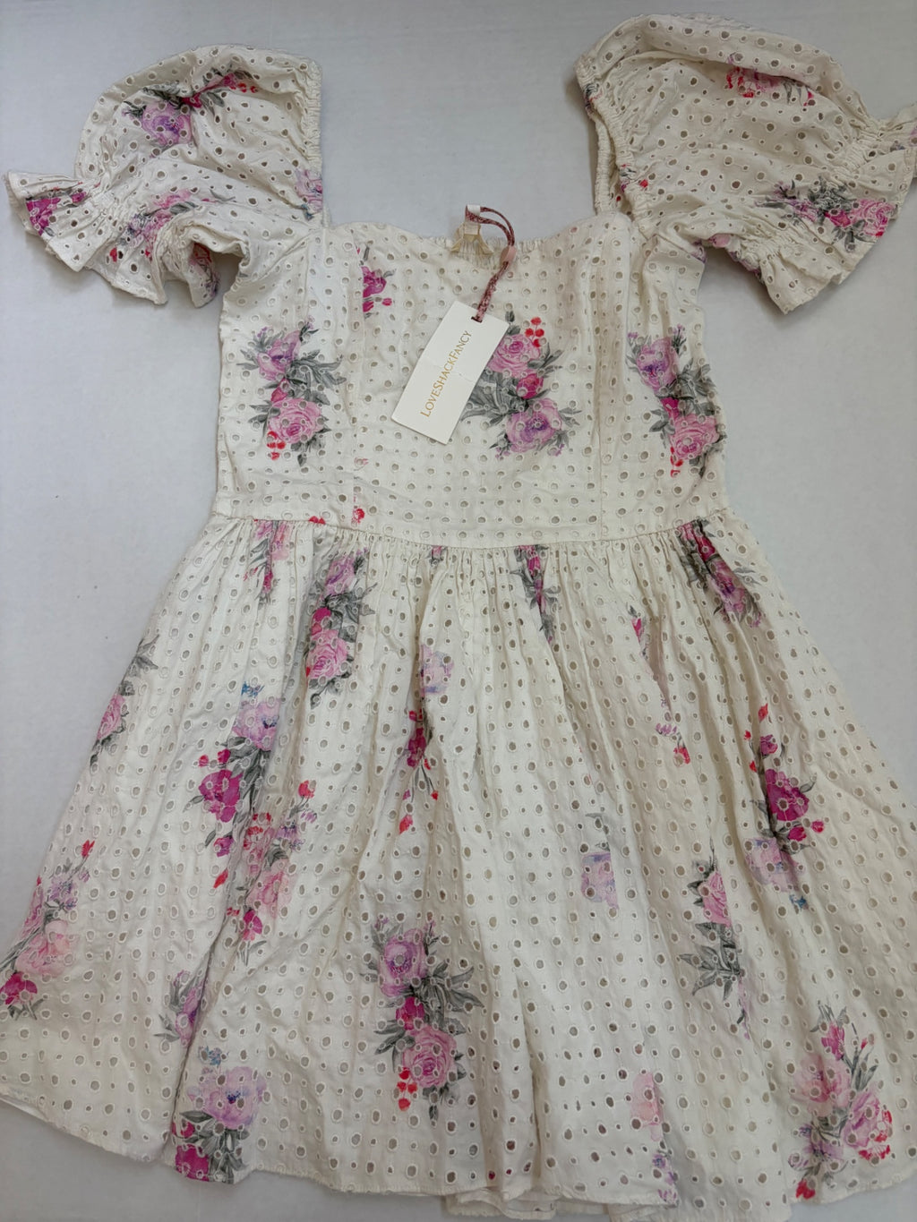 LOVESHACKFANCY Dresses/Rompers Extra Small Off-white/Beige with pink, purple, and gray floral printCotton eyelet fabric with floral print and smocked bodice