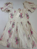 LOVESHACKFANCY Dresses/Rompers Extra Small Off-white/Beige with pink, purple, and gray floral printCotton eyelet fabric with floral print and smocked bodice
